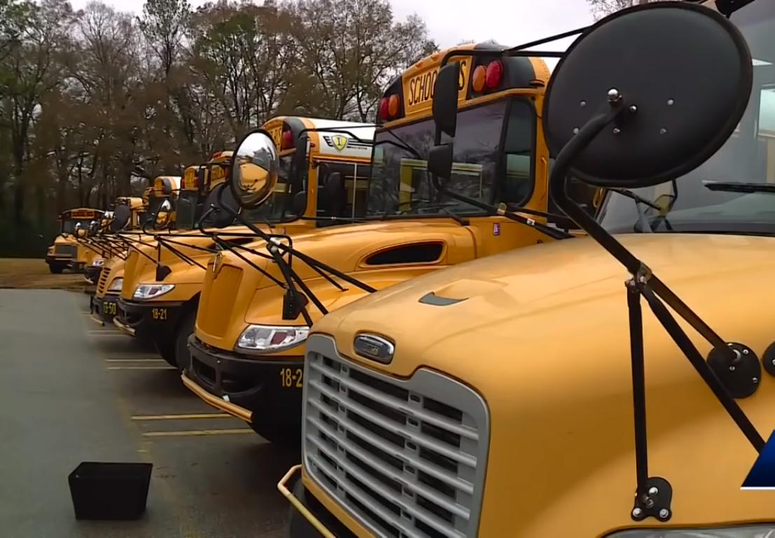 Row of school buses (for illustrative purposes), Photo Credit: WVTM 13 News/Youtube