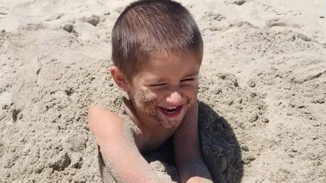 Killian Gonzales playing in the sand