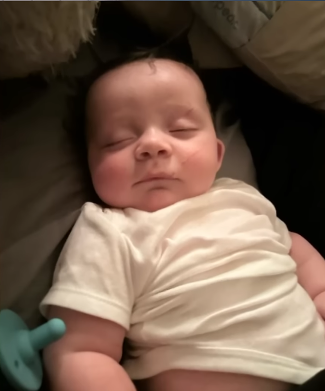 Baby Lord sleeping peacefully in a bed, Photo Credit: NBC News