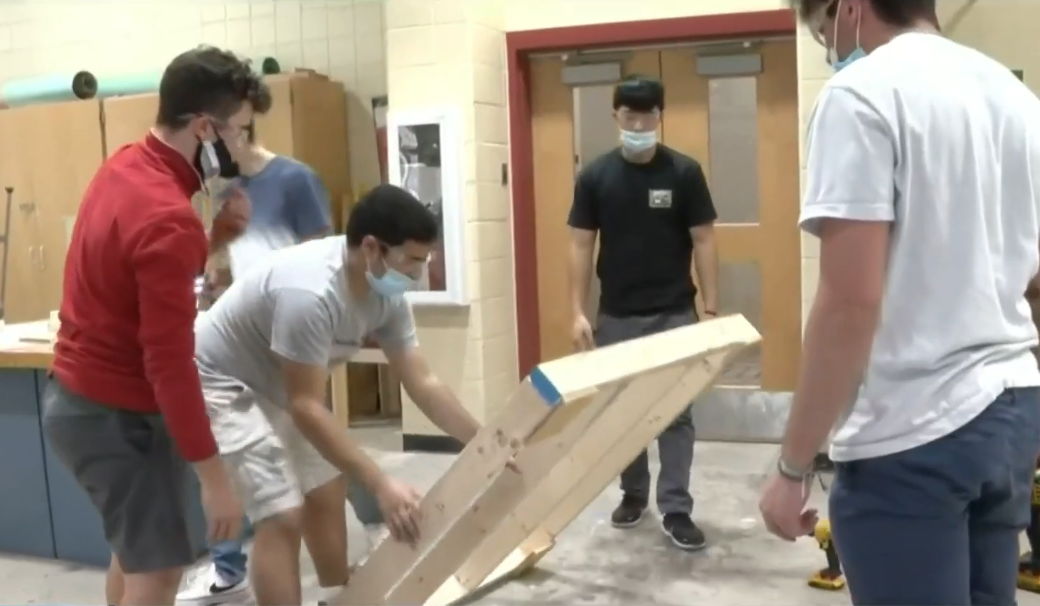 Construction Technology class at Westerly High School constructing a sheltered bus stop shed for a boy with wheelchair, Photo Credit: Click On Detroit | Local 4 | WDIV/Youtube