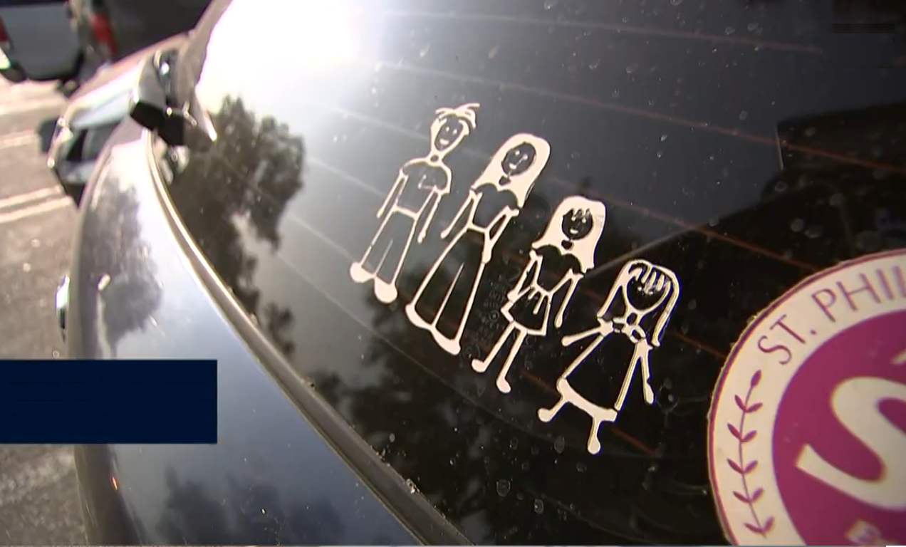 A stick-figure family car window decal on the rear window, Photo Credit: WSAV3/Youtube