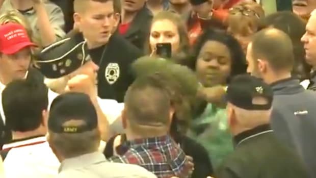 Black Woman Is Roughed Up At Trump Rally (Video) Promo Image