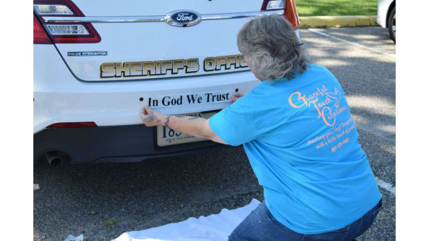 'In God We Trust' Added To V.A. County Police Cars Promo Image