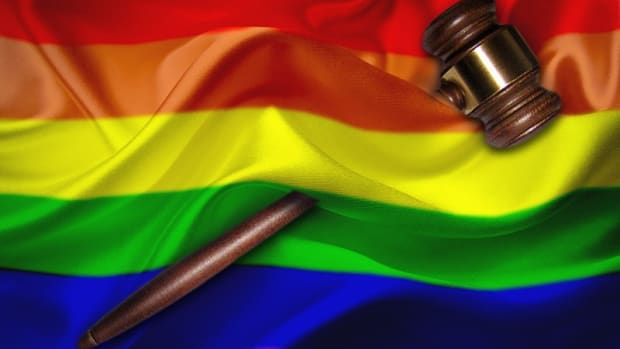 LGBTQ rainbow flag with gavel on it