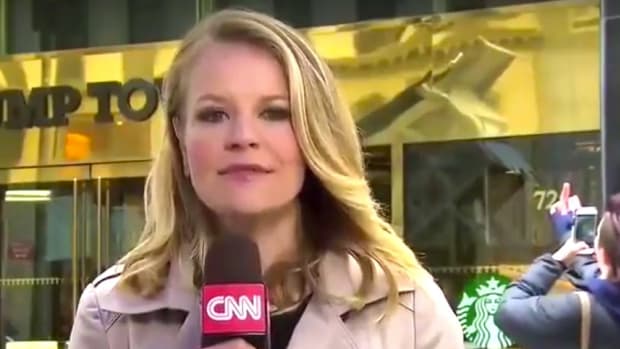 Woman Gives The Finger To Trump Tower On CNN (Video) Promo Image