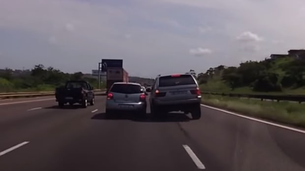 a driver with road rage nearly crashes into another car