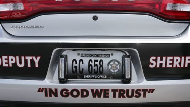 In God We Trust on a police car