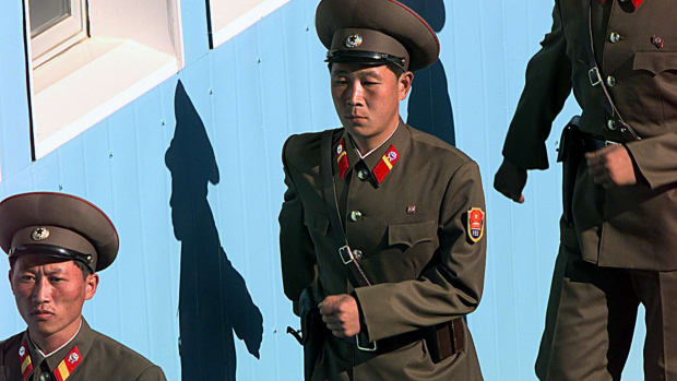 North Korean soldiers march during a ceremony