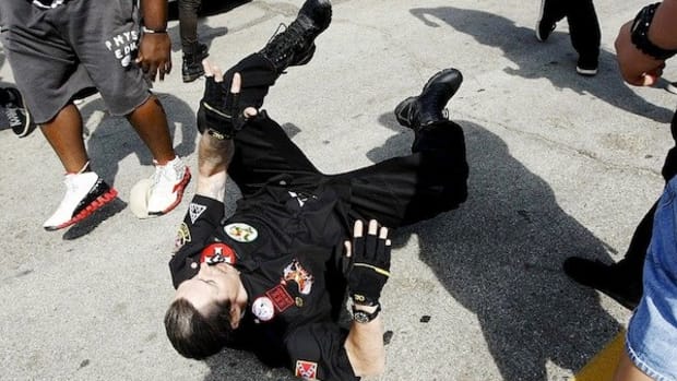 Three People Stabbed During Brawl At KKK Rally  Promo Image