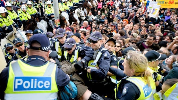 Police maintain order as hardline United Patriots Front protesters clash with anti-racist protesters on the steps of the Richmond Town Hall in May