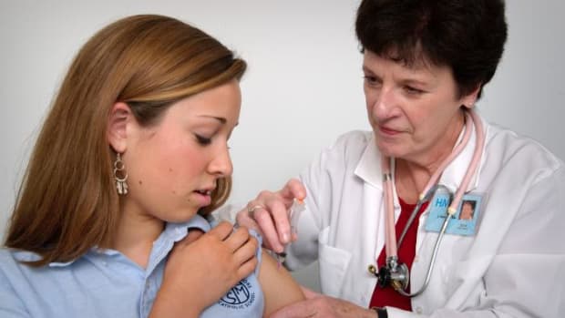 A girl receiving a vaccination.
