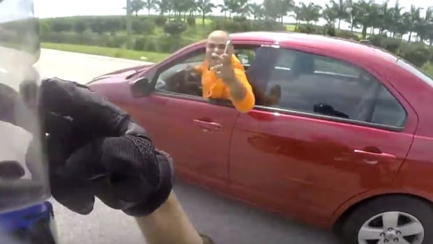 Motorcyclist And Driver In Wild Road Rage (Video) Promo Image