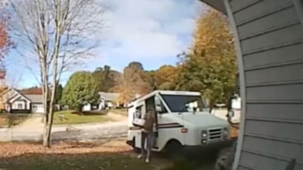 USPS Driver Throws Package.