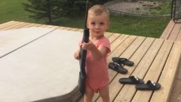 Photo Of 2-Year-Old With BB Gun Goes Viral (Photos) Promo Image