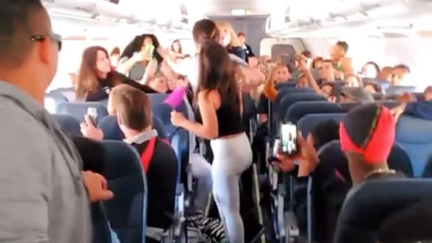 In-Flight Brawl Breaks Out Over Boom Box (Video) Promo Image