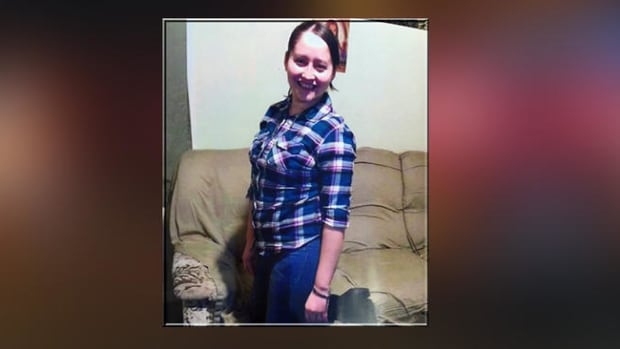 Deceased NY woman Miriam Velez-Samayoa posing in front of a couch