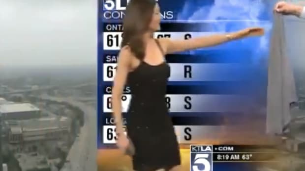 TV Anchor Covers Up Meteorologist's Dress (Video) Promo Image