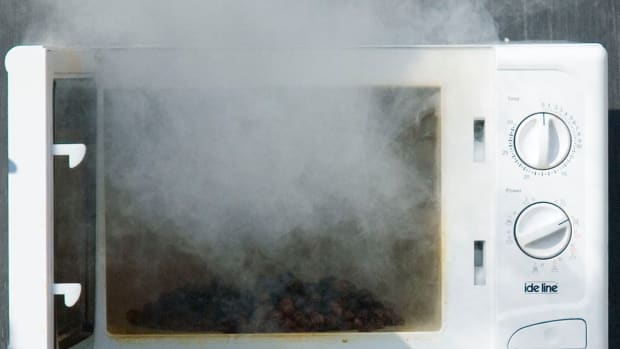 microwave with smoke coming out of it