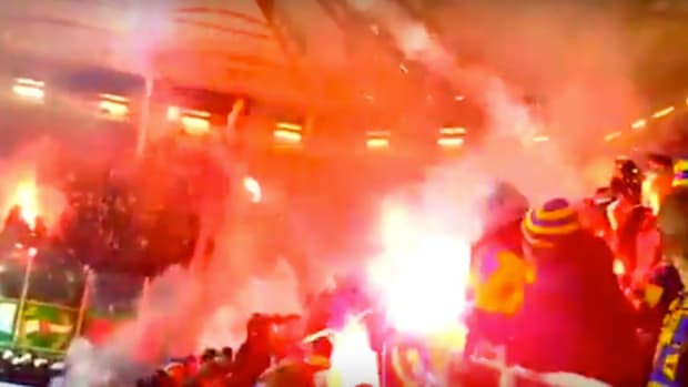 Fans Shoot Flares At Each Other During Soccer Game (Video) Promo Image