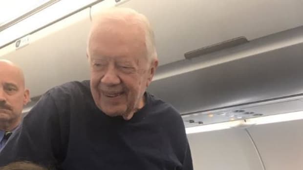 Jimmy Carter Seen On Passenger Flight To DC Promo Image
