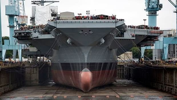 Trump Visits Warship To Push Defense Spending Promo Image