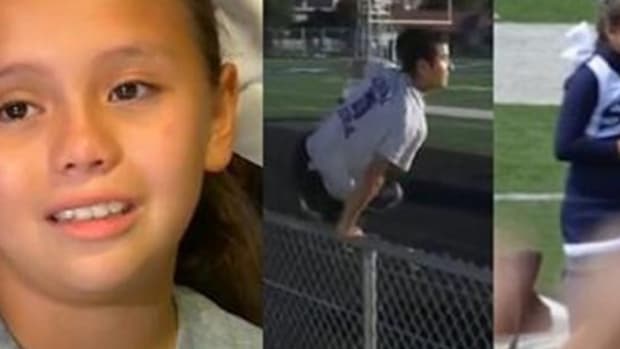 Cheerleader Sobs During Daddy-Daughter Cheer Because Dad's Overseas, Then Stranger Hops Fence Promo Image