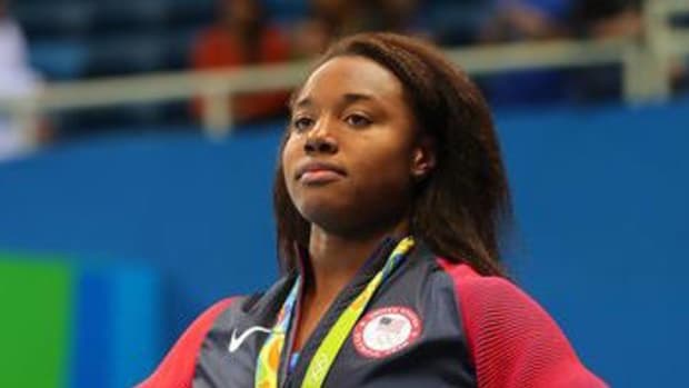 American Gold Medalist Speaks Out About Police Brutality (Video) Promo Image