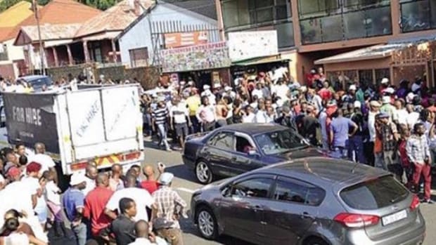 Enormous Crowd Gathers Around Car, Passersby Quickly Figure Out Why Promo Image