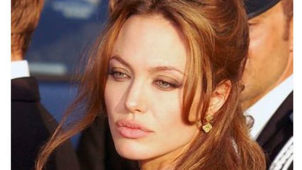 Angelina Jolie Buys Teddy Bear From Young Twins (Video) Promo Image
