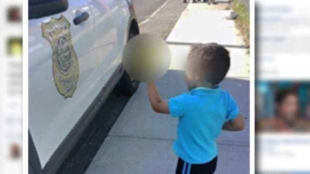Photo Of Boy Flipping Off Police Goes Viral (Video) Promo Image