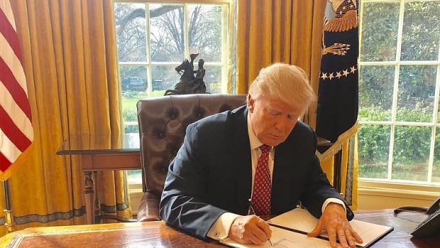 Trump Uses Red Button On Desk For Unusual Reason (Photo) Promo Image