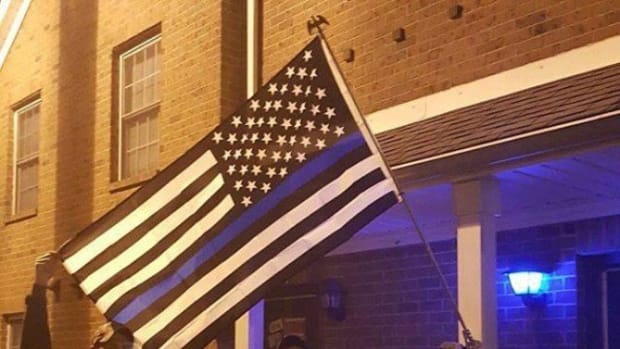 Officers Photograph Student's American Flag, Are Stunned When They Realize What Else Is In The Photo Promo Image
