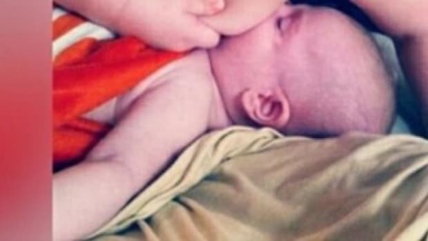 Mom's Photo Of Baby Son And His Sibling Sparks Controversy (Photo) Promo Image