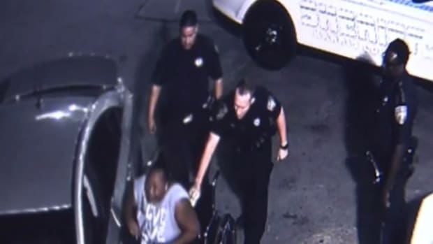 Cop Tases Disabled Black Mom Filming Daughter's Arrest (Video) Promo Image