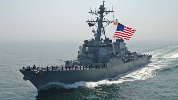 US Navy Destroyer Fires Warning Shots At Iranian Ship Promo Image