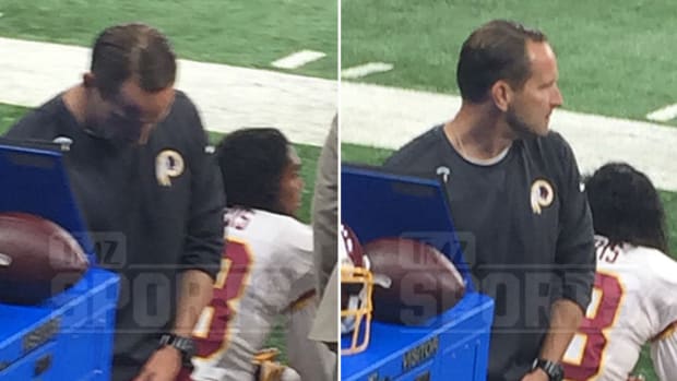 Redskins Coach Caught Urinating During NFL Game (Photo) Promo Image