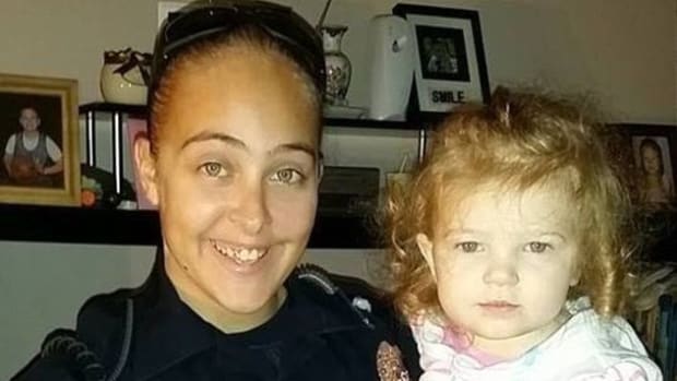 Officer Fired After Leaving Daughter In Car Promo Image
