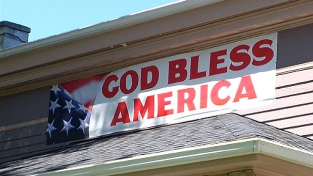 Cafe Owner Asked To Take Down 'God Bless America' Banner Promo Image