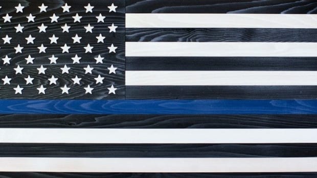 Here's What That Flag With A Blue Stripe Means (Photo) Promo Image