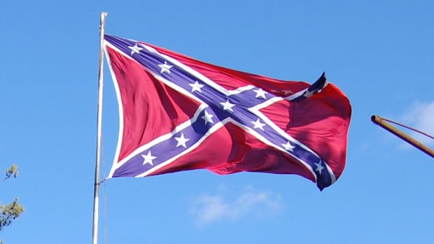 Confederate Flag Flies Near NCAA Tournament Arena Promo Image