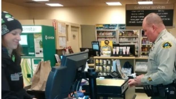 Officer Helps Elderly Veteran Buy Groceries Promo Image