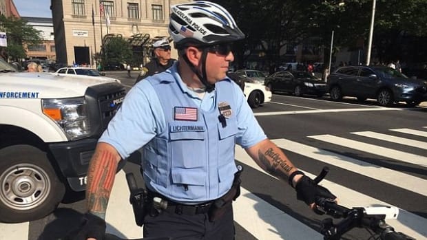 Photo Of Cop With Questionable Tattoos Goes Viral (Photos) Promo Image