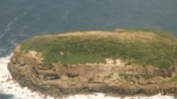 Navy Airship Spots Word Spelled Out On Lone Island, Takes Immediate Action (Photo) Promo Image