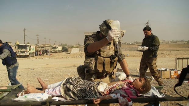 US-Led Airstrike Kills 200 Civilians In Iraq Promo Image