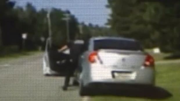 Woman Runs Over Police Officer With Car (Video) Promo Image