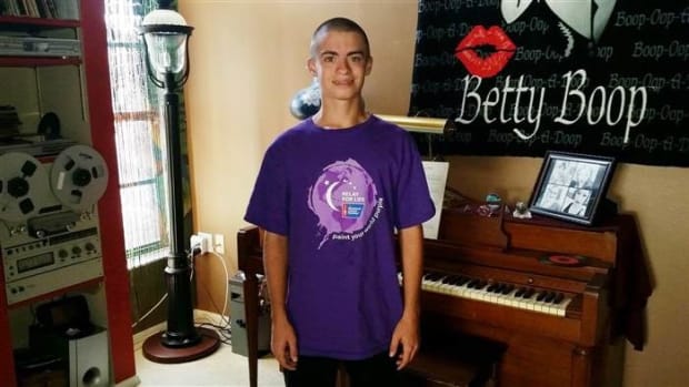 Teen Cancer Survivor In Hot Water Over T-Shirt Promo Image