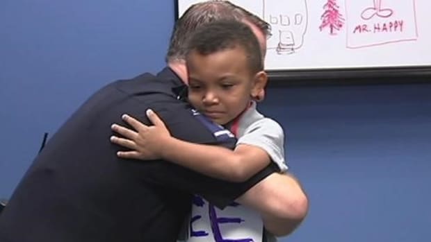 5-Year-Old Boy Gives Police Free Hugs, Doughnuts (Photos) Promo Image