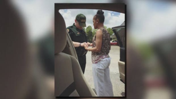 Photo Of Woman And Police Officer Praying Together Goes Viral Promo Image