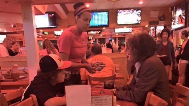Waitress And Boy Help Homeless Man With Food (Photo) Promo Image