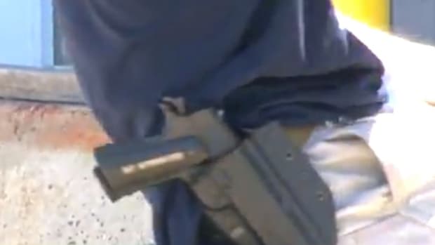 Gun Store Worker Harasses TV Reporter (Video) Promo Image